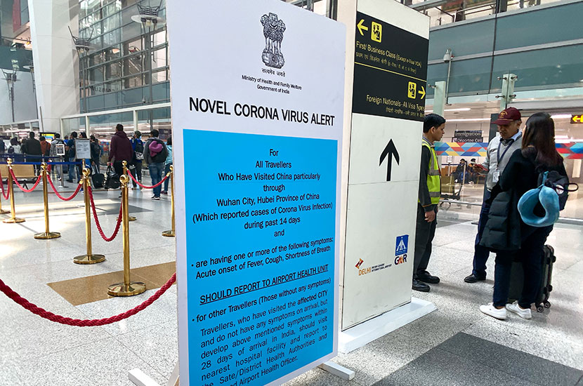 US Citizenship and Immigration Service During Covid-19 Crisis Sign at immigration in the Delhi Airport asking passengers who may have contracted Corona Virus to report to Health Unit