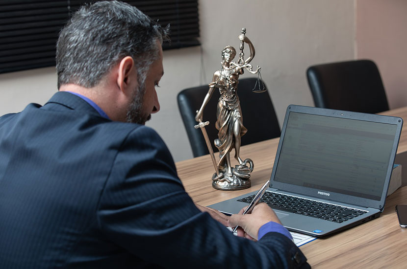 skilled lawyer writing on the paper