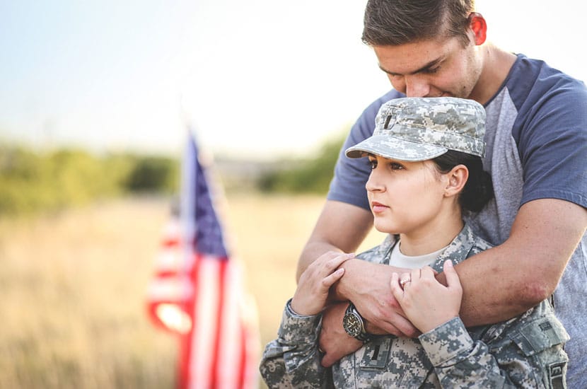 Husband hugs wife in the army