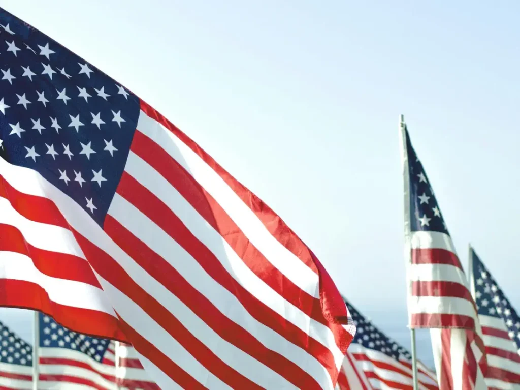 Multiple American flags waving