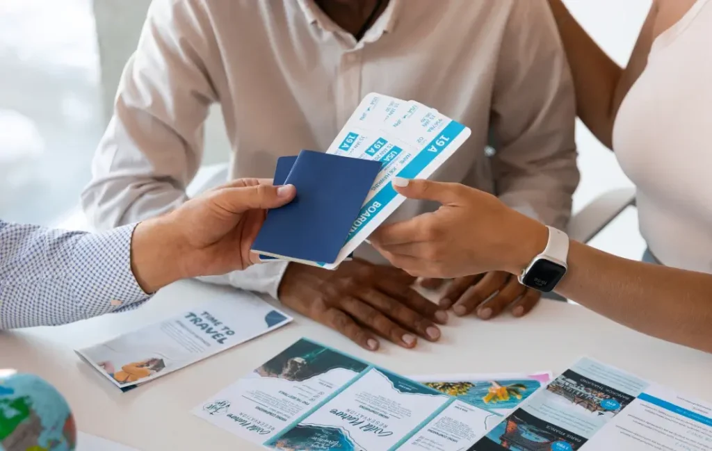 Hand over tickets and passports to customers